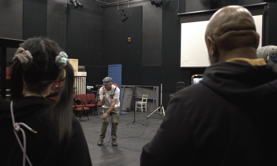 Kevin Winter performing in front of a group of students at Todd Studio Theatre on Friday for an open mic event.
